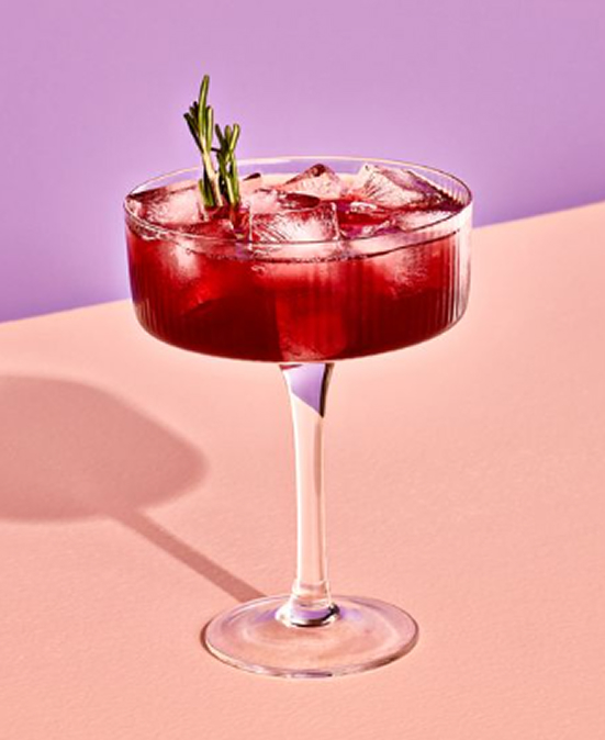 A mocktail in martini style glass made with Fre alcohol-removed wine
